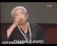 An Older Woman Is Giving A Speech And Says Thank Gawd . GIF