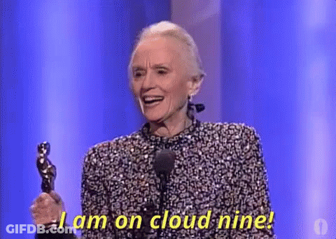 An Older Woman Is Holding An Oscar Statue On A Stage And Saying `` I Am On Cloud Nine ! '' GIF