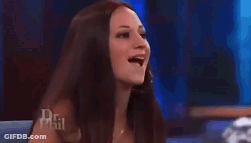 An Older Woman Is Sitting In Front Of A Crowd On A Television Show . GIF