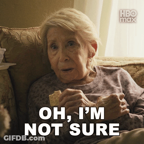 An Older Woman Sitting On A Couch Eating Chips With The Words Oh I 'M Not Sure Behind Her GIF