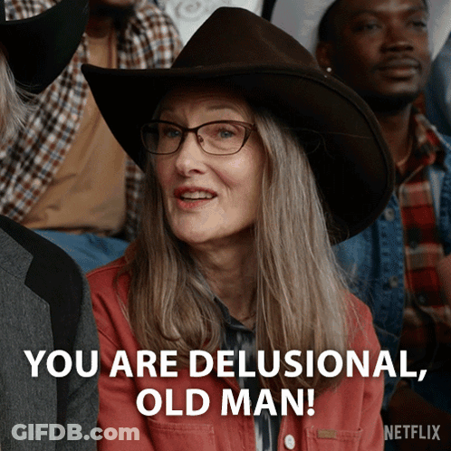 An Older Woman Wearing A Cowboy Hat And Glasses Says You Are Delusional Old Man GIF