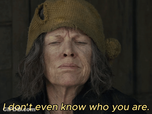 An Older Woman Wearing A Knitted Hat Says I Don 'T Even Know Who You Are GIF