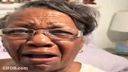 An Older Woman Wearing Glasses Is Crying And Making A Funny Face . GIF