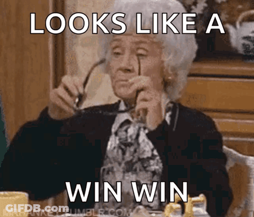 An Older Woman Wearing Glasses Is Sitting At A Table With A Caption That Says " Looks Like A Win Win " GIF