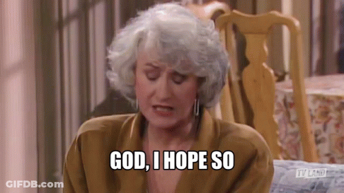 An Older Woman With Gray Hair Is Sitting In A Chair And Saying `` God , I Hope So '' . GIF