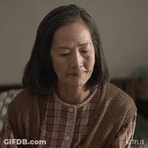 Older Woman With Closed Eyes And Netflix Logo GIF