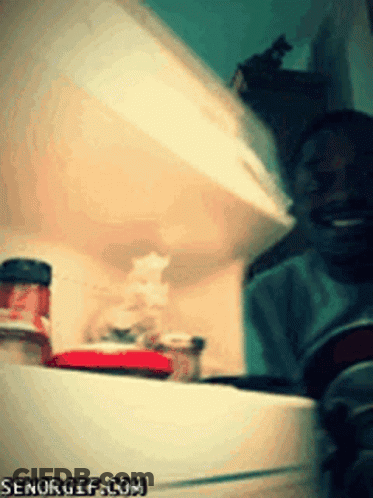 An Open Refrigerator With A Bottle Of Ketchup On The Bottom Shelf And Senorgif.com In The Corner GIF