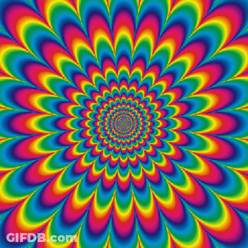 An Optical Illusion Of A Rainbow Colored Flower With A Center In The Middle GIF