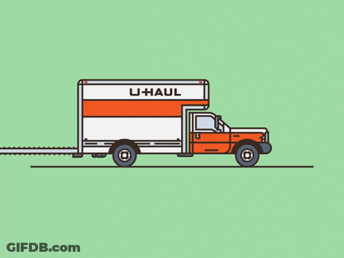 An Orange And White U-Haul Truck With A Couch And Flowers On The Back GIF