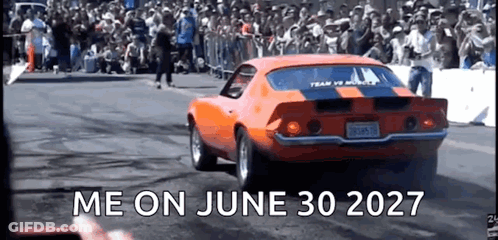 An Orange Car Is Driving Down A Race Track With The Words Me On June 30 2027 Written On The Bottom GIF