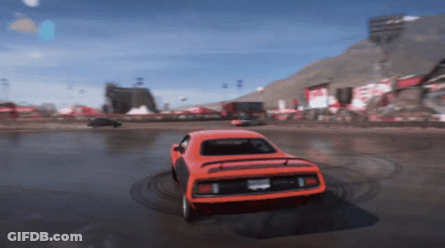 An Orange Car With A California License Plate Is Driving On A Race Track GIF
