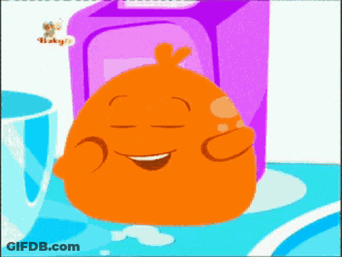 An Orange Cartoon Character Is Smiling In Front Of A Box That Says Baby 'S GIF