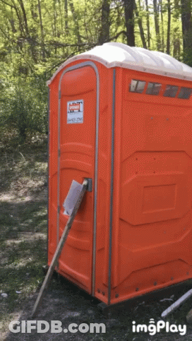 An Orange Portable Toilet With A Sticker On It That Says Imgplay GIF