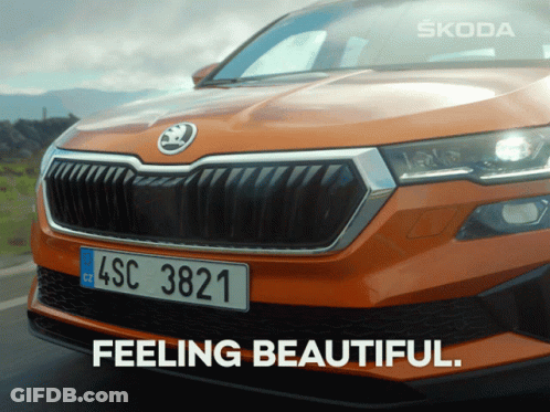 An Orange Skoda Car With A License Plate That Says 4Sc 3821 GIF