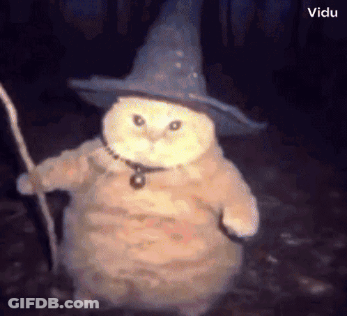 An Owl Wearing A Wizard Hat And Holding A Staff GIF