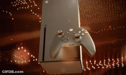 An Xbox Controller Is Sitting Next To A Box GIF