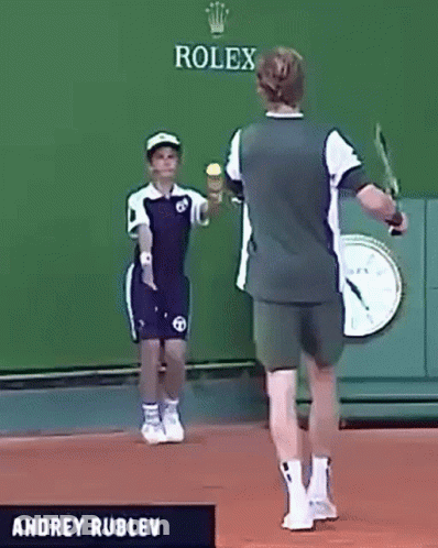 Andrey Rublev Is Playing Tennis In Front Of A Rolex Banner GIF