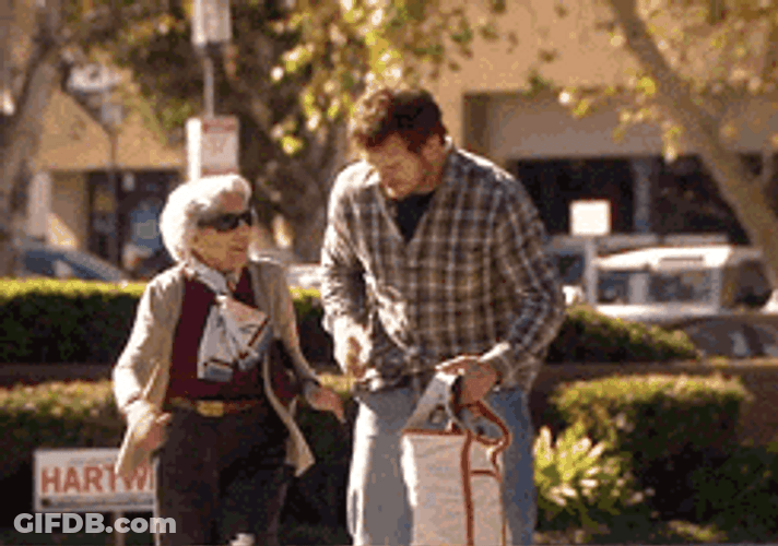 Andy Dwyer Assisting An Old Woman GIF