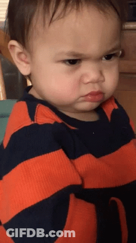 Angry Baby In Orange And Black Striped Shirt GIF