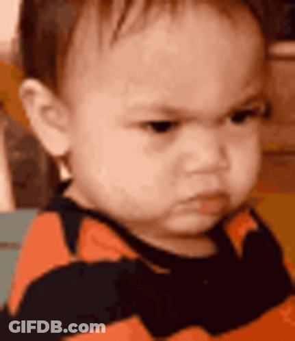 Angry Baby In Striped Shirt GIF