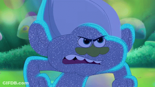 Angry Blue Troll With Green Nose And Mouth GIF