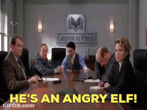 Angry Elf Words On Conference Table GIF