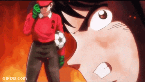 Angry Man In Red Shirt Holding Soccer Ball GIF