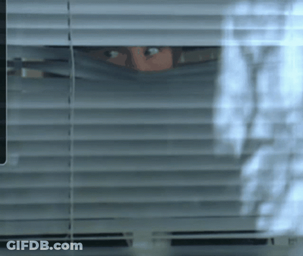 Angry Man Looking Out The Window GIF