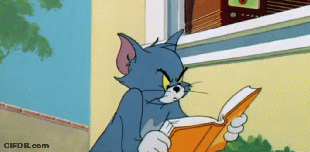 Angry Tom Cat Reading Book GIF