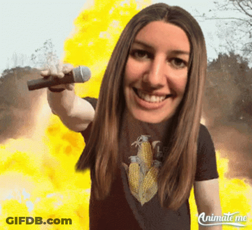 Animate Me Shows A Woman Holding A Microphone In Front Of A Fire GIF