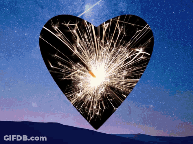 Animated Heart In The Sky With Fireworks GIF
