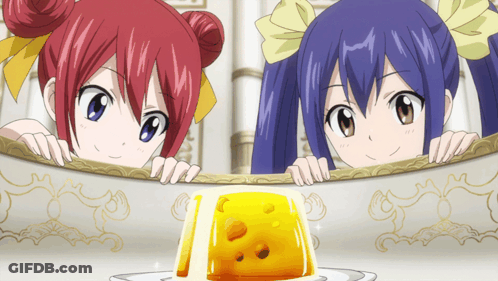 Anime Girls Peeking Over Table Near Yellow Jelly GIF