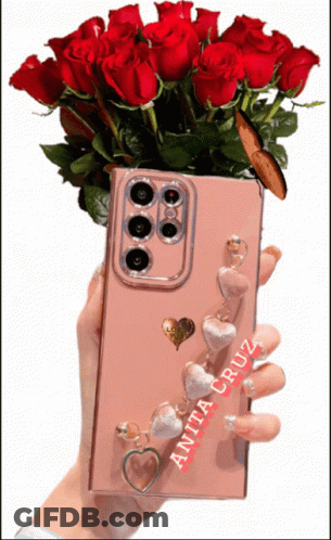 Anita Cruz Holding Phone With Red Roses GIF