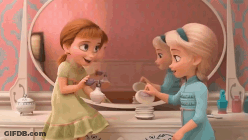Anna And Elsa Are Playing With Perfume In Front Of A Mirror In A Bathroom . GIF