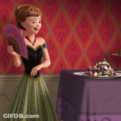 Anna From Frozen Holding Fan In Front Of Chocolates GIF