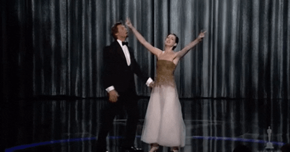 Anne Hathaway Raising Her Hands GIF