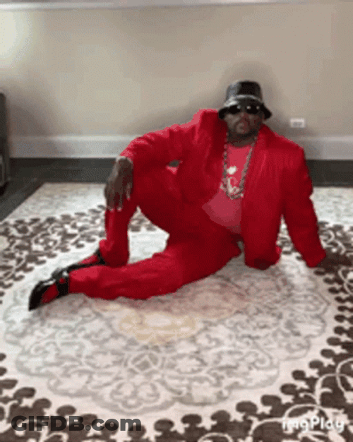 Anthony Adams In Red Suit Windmill Breakdance GIF