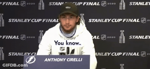 Anthony Cirelli Sitting In Front Of Stanley Cup Sign GIF