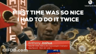 Anthony Joshua Is Holding A Boxing Glove In His Hands GIF