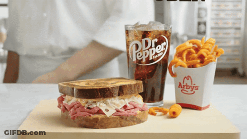Arby's Sandwich And Drink On Wooden Cutting Board GIF