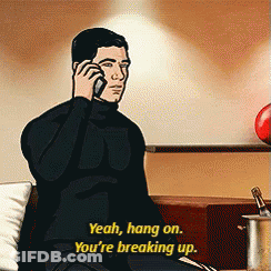 Archer Is Sitting On A Couch Talking On A Cell Phone GIF
