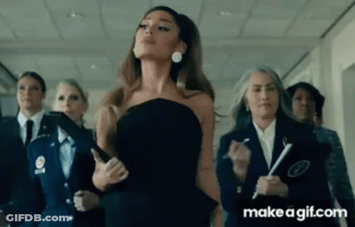 Ariana Grande In Black Dress In Hallway With Group GIF