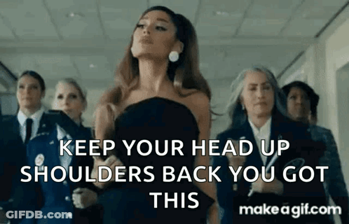 Ariana Grande In Black Dress With Group In Hallway GIF