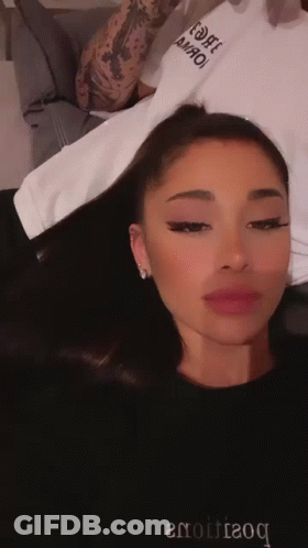 Ariana Grande In Black Sweater Saying Boutique GIF