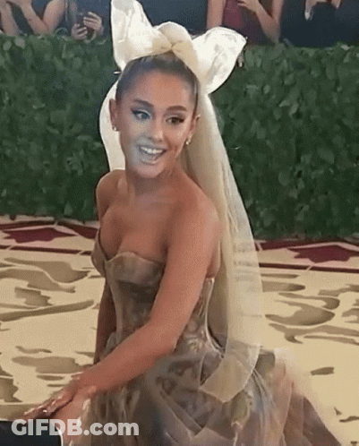 Ariana Grande In Strapless Dress With Veil And Bow At Met Gala GIF
