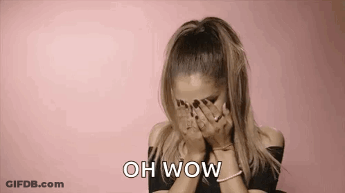 Ariana Grande Is Covering Her Face With Her Hands And Says Oh Wow . GIF