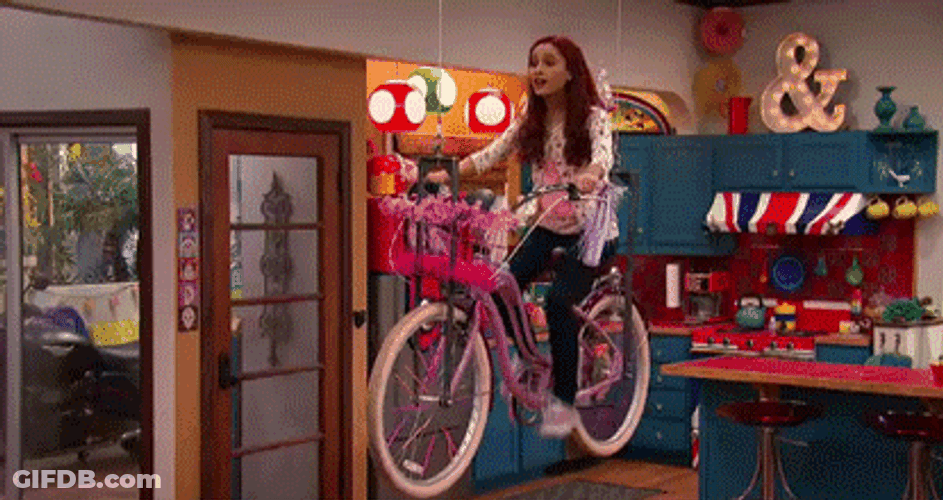 Ariana Grande Riding Cycle GIF