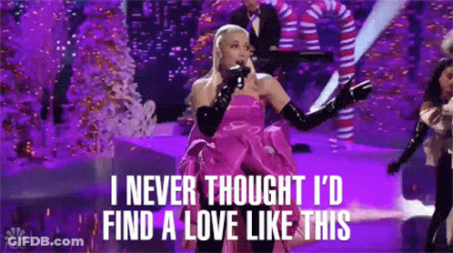 Ariana Grande Singing Into Microphone In Pink Dress And Gloves GIF