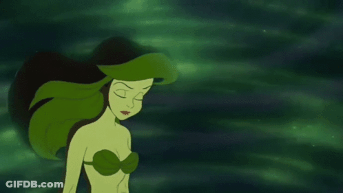 Ariel From The Little Mermaid Has Green Hair And A Green Light Coming Out Of Her Mouth . GIF
