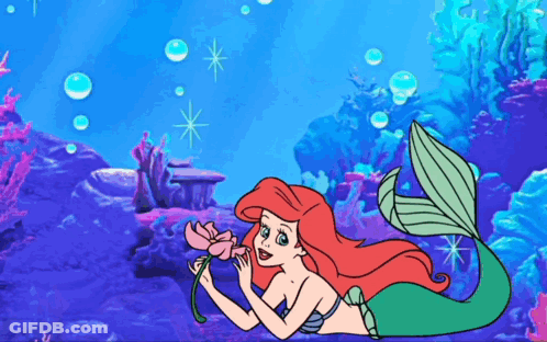 Ariel From The Little Mermaid Is Holding A Pink Flower GIF